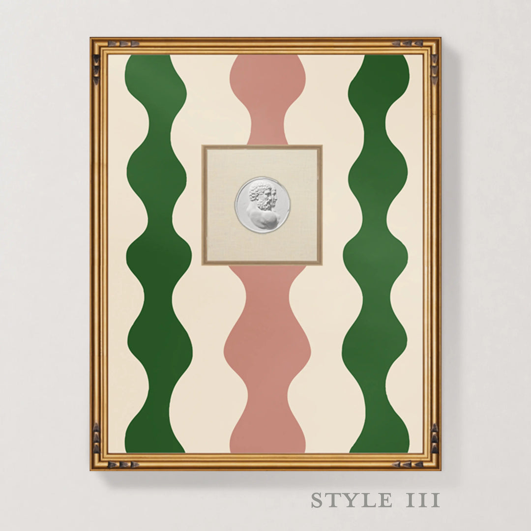 Framed wall art featuring a central silver coin surrounded by wavy vertical stripes in green, dusty pink, and cream, set in a gold-toned frame against a light gray wall. The text 'STYLE III' appears below the frame.