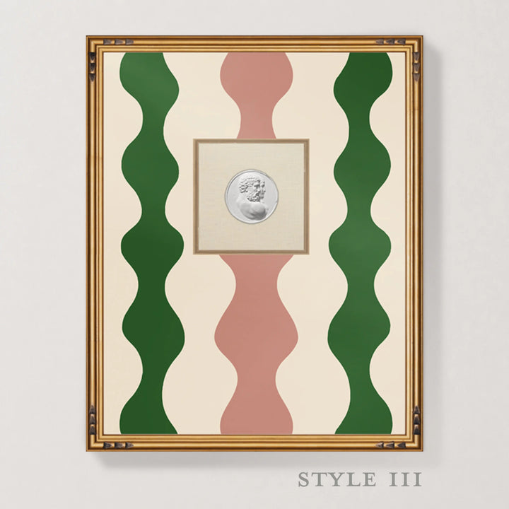 Framed wall art featuring a central silver coin surrounded by wavy vertical stripes in green, dusty pink, and cream, set in a gold-toned frame against a light gray wall. The text 'STYLE III' appears below the frame.